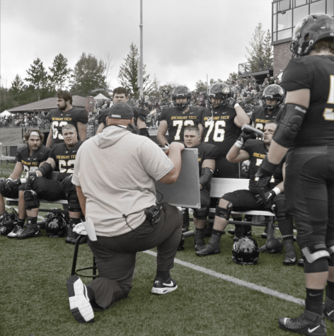 The MTU Mens Football Team receives coaching during the Sept. 28 game against Saginaw Valley State. Photograph and Colorization by Tim Peters